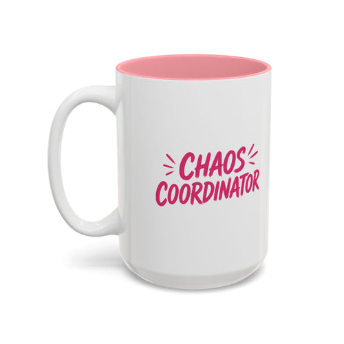 White coffee mug with pink interior featuring bold pink Chaos Coordinator text design