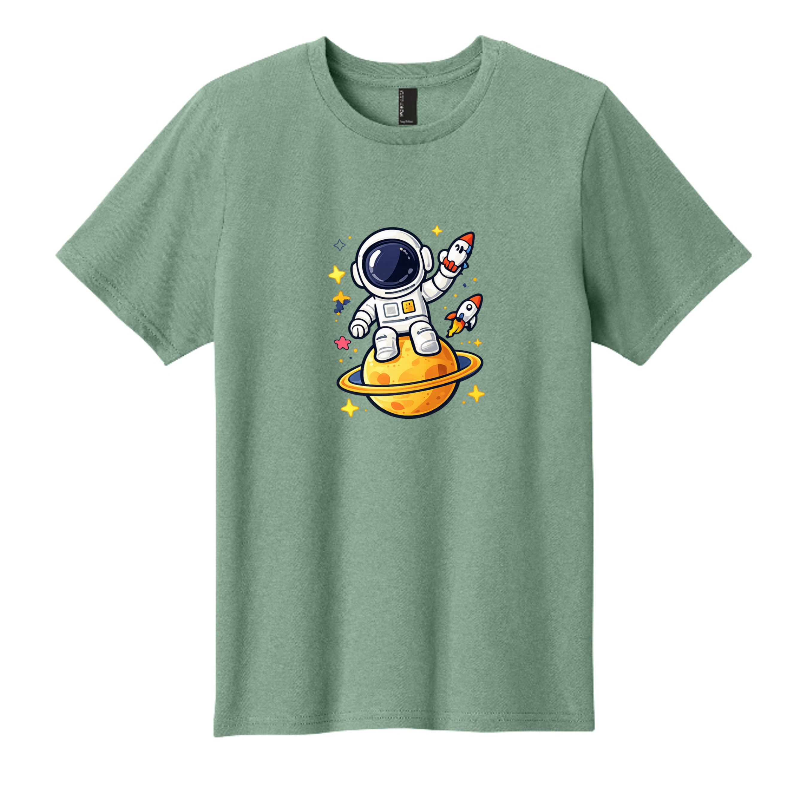 Cute kids astronaut t-shirt graphic featuring a smiling astronaut standing on a yellow ringed planet with rockets, stars, and outer space details.